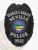 Seville Police Search & Rescue custom black metal badge with an eagle perched above the shield shape, white text SEARCH & RESCUE, SEVILLE, and POLICE on curved banners, a colorful State of Ohio round emblem in the center, and the number 9920 at the bottom, equipped with a safety pin attachment.