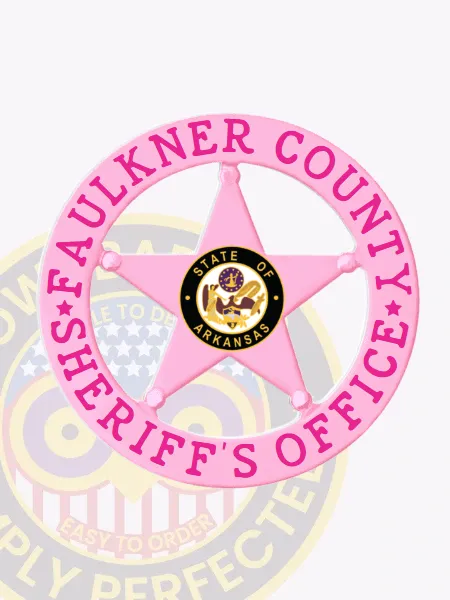 Five-point pink star badge surrounded by a pink circle banner reading Faulkner County Sheriff’s Office in bright pink letters, with the State of Arkansas emblem in the center, designed with a safety pin fastener