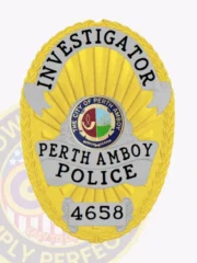 Gold oval custom metal badge for Perth Amboy police dept., showcasing a sunburst gold background with detailed leaf borders, "INVESTIGATOR" printed in black on a silver arching banner at the top, the multi-colored city seal of Perth Amboy in the middle, "PERTH AMBOY POLICE" on a large silver scroll below, and "4658" on a silver rectangular plate at the bottom, equipped with a safety pin attachment.