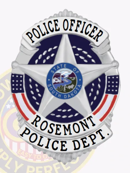Custom Rosemont police officer badge in silver metal shield form with safety pin attachment, highlighting a large silver five-point star encircling the State of South Dakota emblem, flanked by white banners labeled POLICE OFFICER and ROSEMONT POLICE DEPT., and American flag colors on each side.