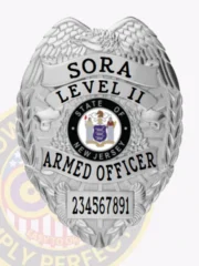 Silver eagle crest badge for New Jersey SORA officers, engraved with SORA LEVEL II ARMED OFFICER and a personalized identification number 234567891 beneath the full-color state seal, secured with a safety pin.
