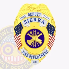 Gold metal deputy badge for sierra fire department, eagle perched on top, blue text on white ribbons, american flags on both sides, and a navy circle in the center displaying gold firefighting gear, designed with a safety pin fastener.