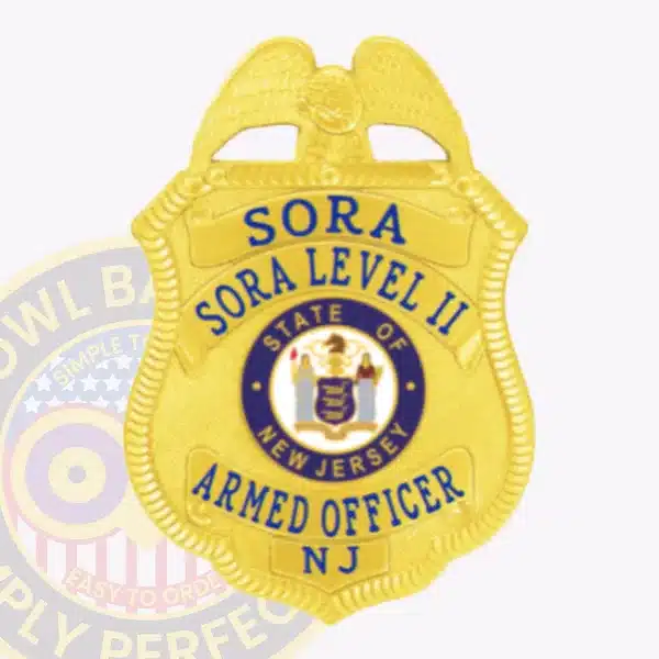 Image of a custom gold eagle top metal badge for SORA Level 2 with safety pin attachment designed for security officers, featuring a bright gold shield with textured edges, an eagle symbol on top, blue lettering, and the New Jersey state seal centrally located.