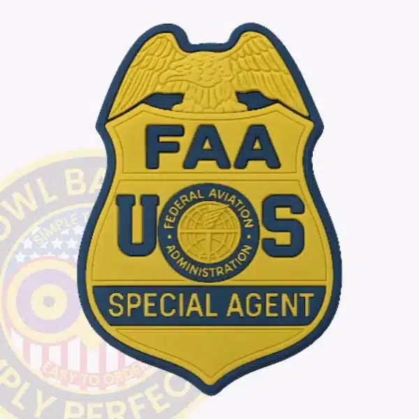 A custom gold eagle top PVC rubber badge for FAA, the special agent with velcro attachment, featuring a detailed gold eagle at the top, embossed letters "FAA" and "U S," and a central seal of the Federal Aviation Administration in blue and gold.