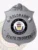 Detailed custom silver metal badge for Colorado State Trooper, showcasing an eagle emblem on top, central state seal, and safety pin attachment for securing.