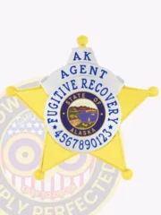 Detailed image of a custom gold 5-point star badge with gold panels and silver highlights for Fugitive Recovery agents in Alaska, showing the state seal prominently in the center, surrounded by blue text and an ID number, with a safety pin fastener.