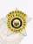Detailed image of a custom silver 5-point star badge with gold panels for Fugitive Recovery agents in Arkansas, showing the Arizona state seal in the center, encircled by gold rings with black text "FUGITIVE RECOVERY AGENT," and a safety pin fastener.