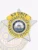 Close-up image of a silver metal 5-point star badge designed for Chicago Police K9 Unit Narcotics Detection, highlighted by a gold banner and ring with blue embossed text, centered by the official City of Chicago emblem, equipped with a safety pin on the back.