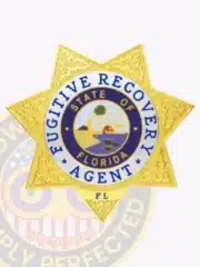 Detailed photo of a custom gold metal badge shaped as a 7-point star with silver accent panels, labeled 'Fugitive Recovery Agent' and 'State of Florida', equipped with a safety pin attachment.