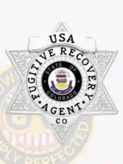 Custom silver 6-point star metal badge for Fugitive Recovery Agent featuring intricate engraving and a central seal with the State of Colorado emblem. The badge reads 'USA Fugitive Recovery Agent CO' and includes a safety pin attachment.