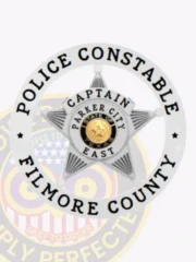 Official silver 5-point star flex badge framed by a circular banner engraved "Police Constable Filmore County," featuring "Captain Parker City East" and the State of Texas seal in the middle, fitted with a safety pin closure.