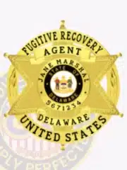 Law enforcement badge shaped as a gold 6-point star inside a circular banner that reads 'Fugitive Recovery Agent Delaware United States.' The center features the State of Delaware emblem, personalized with Jane Marshal and agent number 5671234, with a safety pin attachment.