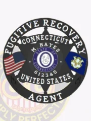 Dark gun metal black 6-point star metal badge for Fugitive Recovery Agent, with a circular banner reading 'Fugitive Recovery Agent United States.' The badge includes the State of Connecticut seal, U.S. and Connecticut flags, personalized with M. Hayes and agent number 612345, and features a safety pin fastening on the back.