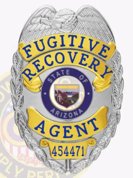 Silver eagle-top badge with gold decorative panels for Fugitive Recovery Agent, displaying the Arizona state seal in the center, bold blue text for "Fugitive Recovery Agent," unique number 454471 at the bottom, and a safety pin fastener.