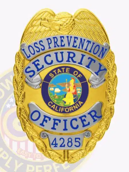 Handheld custom gold badge with silver accents for Loss Prevention Security Officers in California, featuring a prominent eagle top, blue lettering, state seal in the middle, and safety pin backing.
