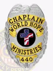 World Hope Ministries chaplain badge with a silver eagle on top, gold panels labeled "CHAPLAIN WORLD HOPE MINISTRIES," a patriotic cross emblem in the center, and badge number "440," designed with a safety pin attachment.