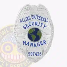 Close-up of a custom silver eagle top metal badge for allied universal, featuring an embossed eagle at the top, blue text reading "allied universal security manager" surrounding a blue and green globe emblem, and badge number 997426, with a safety pin attachment on the back.