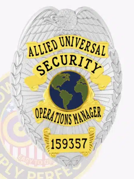 Official custom silver eagle top metal badge for Allied Universal Operations Manager, showcasing gold panels with black text, a globe symbol in the middle, and a safety pin attachment on the back.