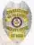 High-resolution image of a Wayne County Corrections assistant warden badge made of silver metal with gold-colored panels, featuring an eagle detail on top, blue lettering, and the State of Arkansas seal prominently in the center.