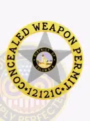 Five-point silver metal star badge surrounded by a gold circular banner stating 'Concealed Weapon Permit 12121C' with the District of Columbia seal in the center, equipped with a safety pin.