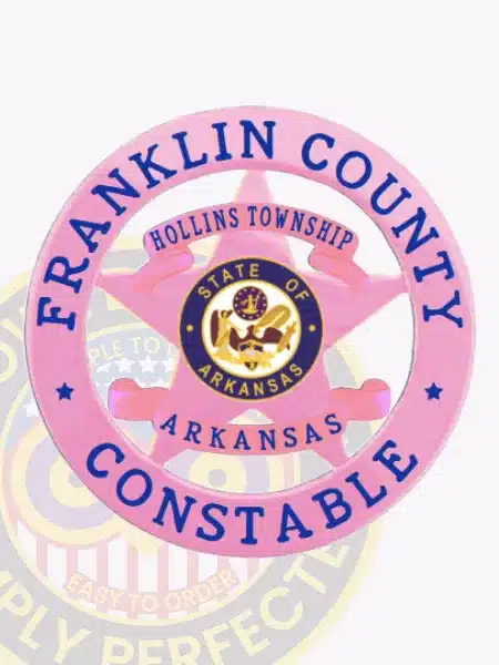 Pink metal 5-point star badge surrounded by a circular band engraved with "Franklin County Constable," highlighting "Hollins Township Arkansas" and the official Arkansas state seal in the middle, fitted with a safety pin for easy wear.