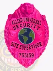 Custom BCAM pink bear top metal badge for Allied Universal Security, labeled 'Site Supervisor' with bold black text, featuring a globe emblem in the center and a safety pin attachment.
