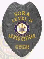 Gun metal black metal badge designed for SORA Level II armed officers, showcasing bold yellow text, intricate eagle wings, official New Jersey state seal in blue and gold, and a safety pin fastener for secure wear.