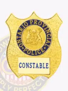 Ontario provincial police custom gold shield metal badge for the constable rank, with embossed provincial crest and blue lettering, designed with a safety pin for easy attachment.
