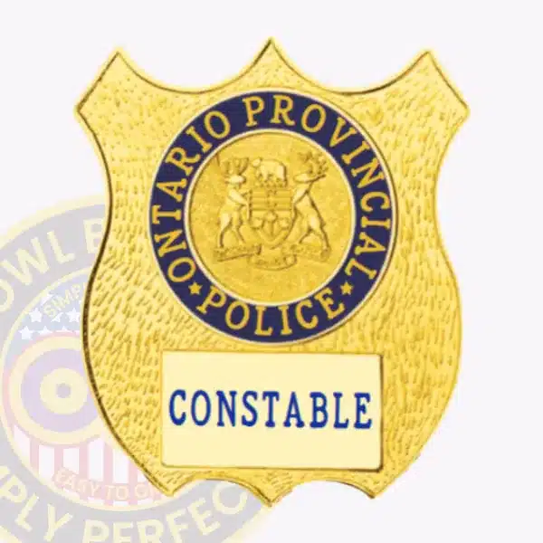 Custom gold shield metal badge for Ontario Provincial Police dept., featuring detailed provincial crest and bold blue 'CONSTABLE' text, with a safety pin attachment for secure fastening.