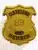 Image showing a custom gold shield metal badge for Fraternal Order of Police Cleveland member with safety pin attachment, featuring the embossed number 23, black text on banners reading “CLEVELAND” and “MEMBER,” and a blue F.O.P.A. emblem on a textured gold badge