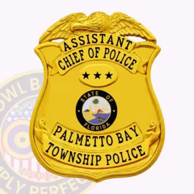 Assistant Chief of Police Eagle Top Front. Front view of a eagle top badge in gold for an assistant chief of police in Palmetto Bay Township