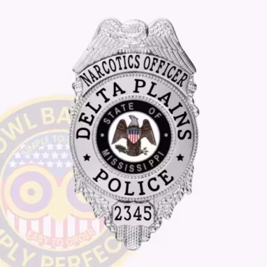 Cop Silver Eagle Top Front. Front view of an eagle top cop badge in silver for a Delta Plains narcotics officer.