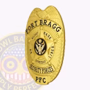 Fort Bragg Security Forces Side. Side view of a Fort Bragg Security Forces badge in gold.
