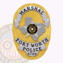 Fort Worth Police Badge Front. Front view of an oval badge with Texas and 5-point-star center for Fort Worth Police in gold and silver.