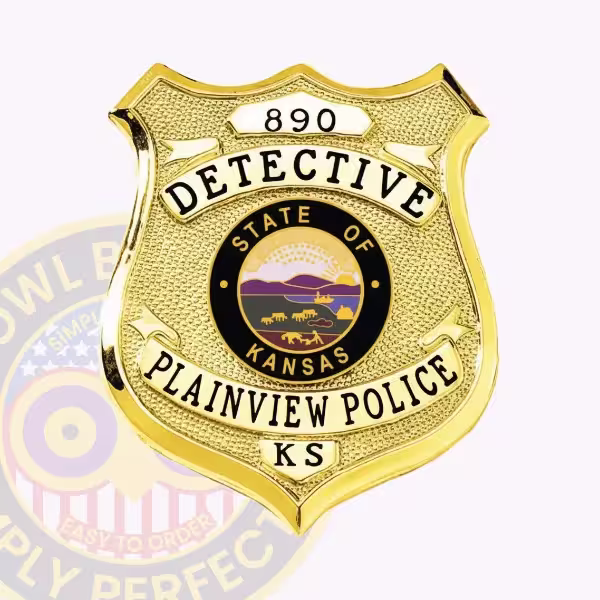 Gold Detective Shield Badge Front. Front view of a shield badge in gold for a Plainview Police detective.