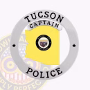 Tucson Police Badge Front. Front view of a Arizona in Circle Banner Tucson Police badge in silver and gold.