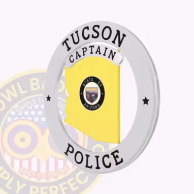 Tucson Police Badge Side. Side view of a silver and gold Tucson Police badge in the shape of Arizona bordered by a circle banner.