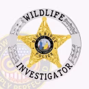 Wildlife Investigator 5 Point Star Badge Front. Front view of a 5 point star wildlife investigator badge in silver and gold.
