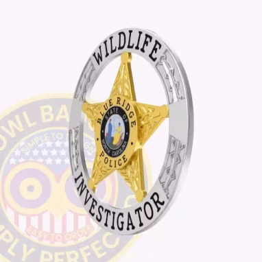 Wildlife Investigator 5 Point Star Badge Side. Side view of a silver and gold 5 point star wildlife investigator badge.