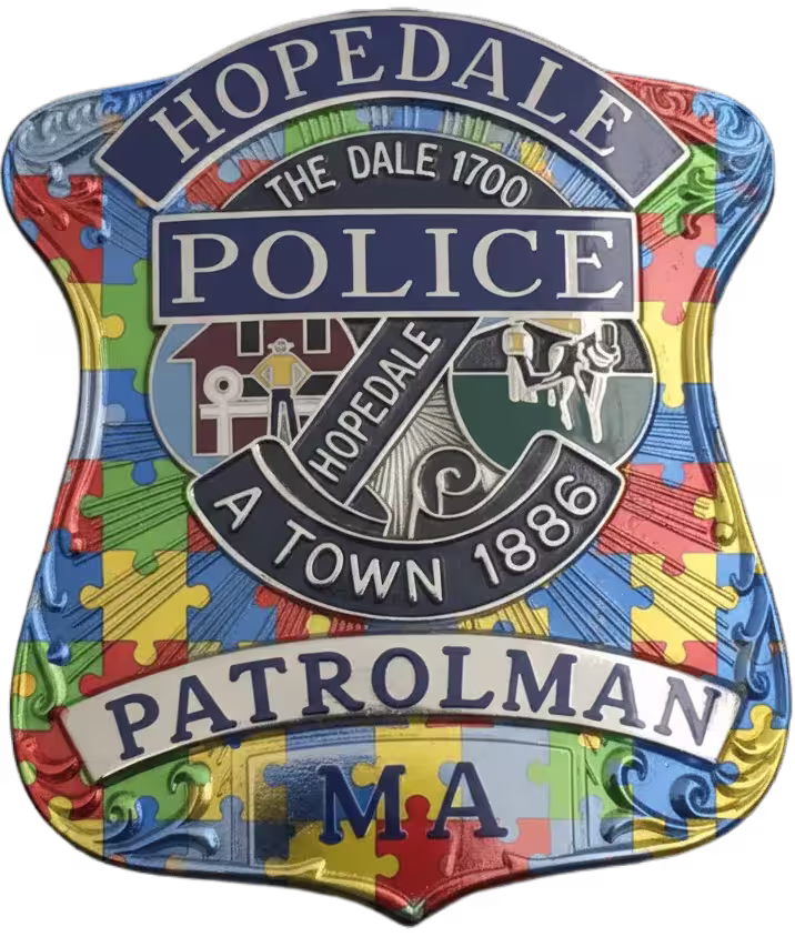 Hopedale Police Patrolman badge with autism awareness puzzle piece background and town seal from Massachusetts