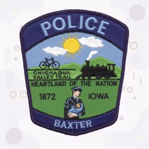 Police shield patch with a steam train and valley trail