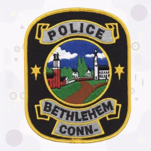 Black rectangle patch with stitched text
