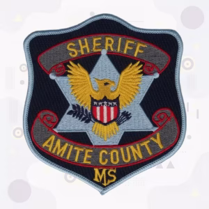 Sheriff patch with a gold eagle, shield and red scroll banners