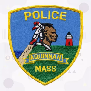 Police patch with a lighthouse and coastal scene