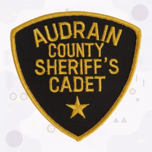 Sheriff cadet patch with gold lettering and a star on black
