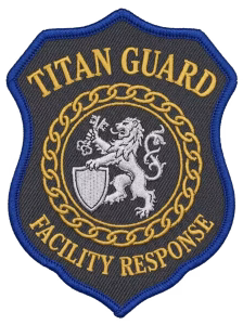 Charcoal and blue guard patch with a gold chain ring and a silver lion